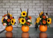 three fall flower arrangements using pumpkins as base