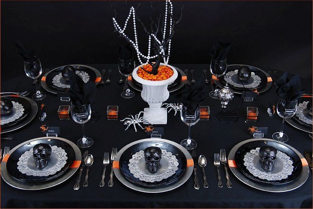 Black and orange table setting for a spooky Halloween dinner party