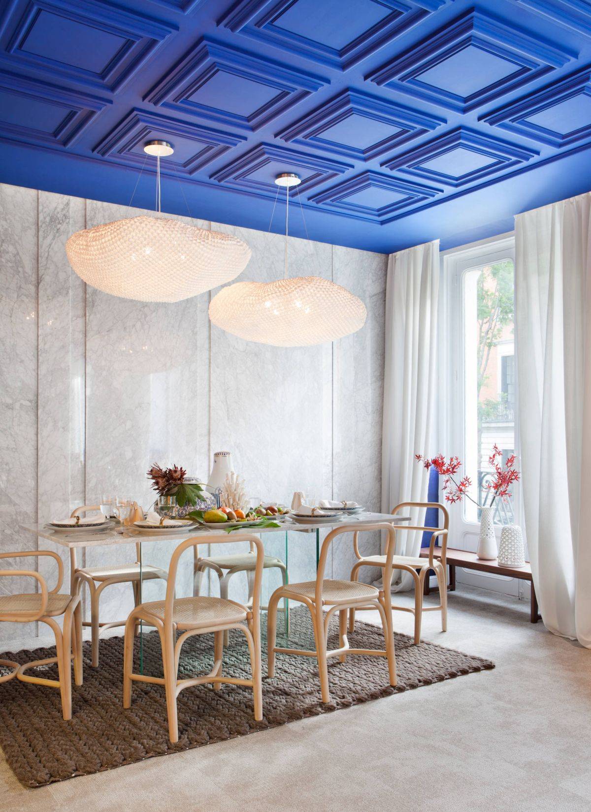 Coffered-ceiling-in-deep-blue-adds-color-to-this-double-height-dining-room-in-white-21460