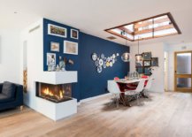 Delightful-blue-accent-wall-skylight-and-a-double-sided-fireplace-brighten-this-dining-room-57176-217x155