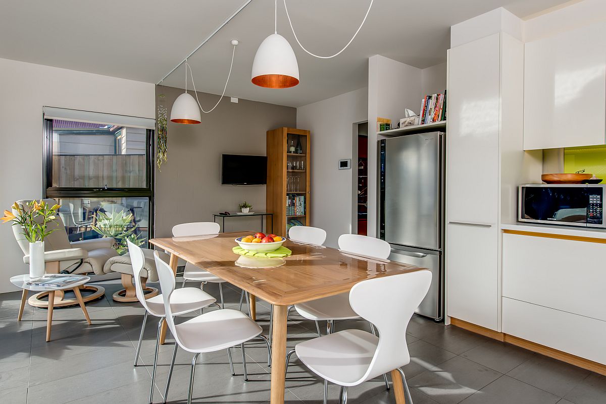 Kitchen-and-dining-area-have-a-common-wood-and-white-color-scheme-94382