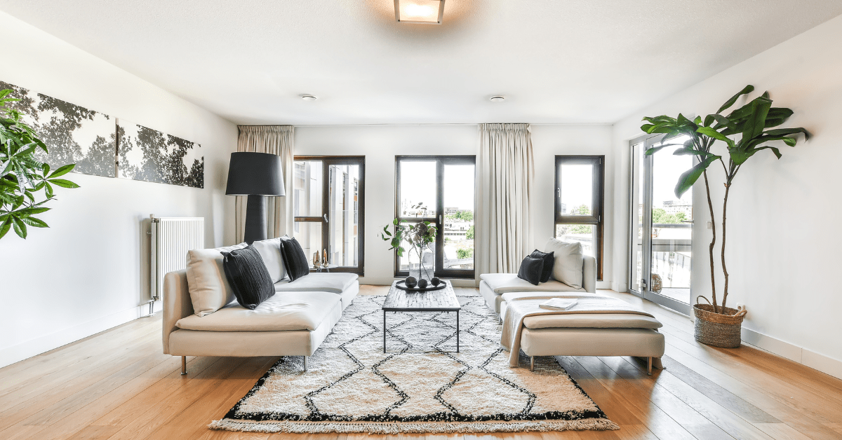 A spacious living room with modern furniture.