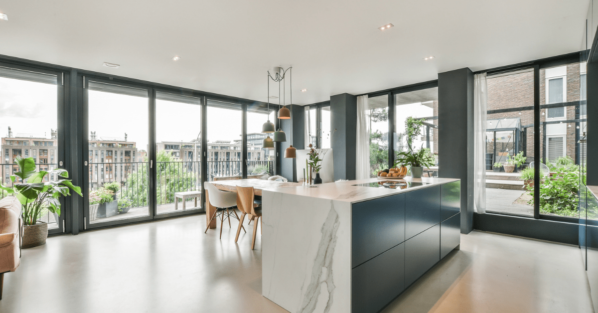 A modern yet luxurious room with ceiling to floor windows.