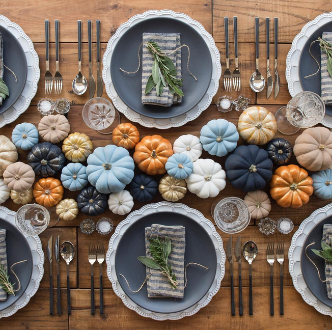 an array of painted pumpkins as a thanksgiving centerpiece