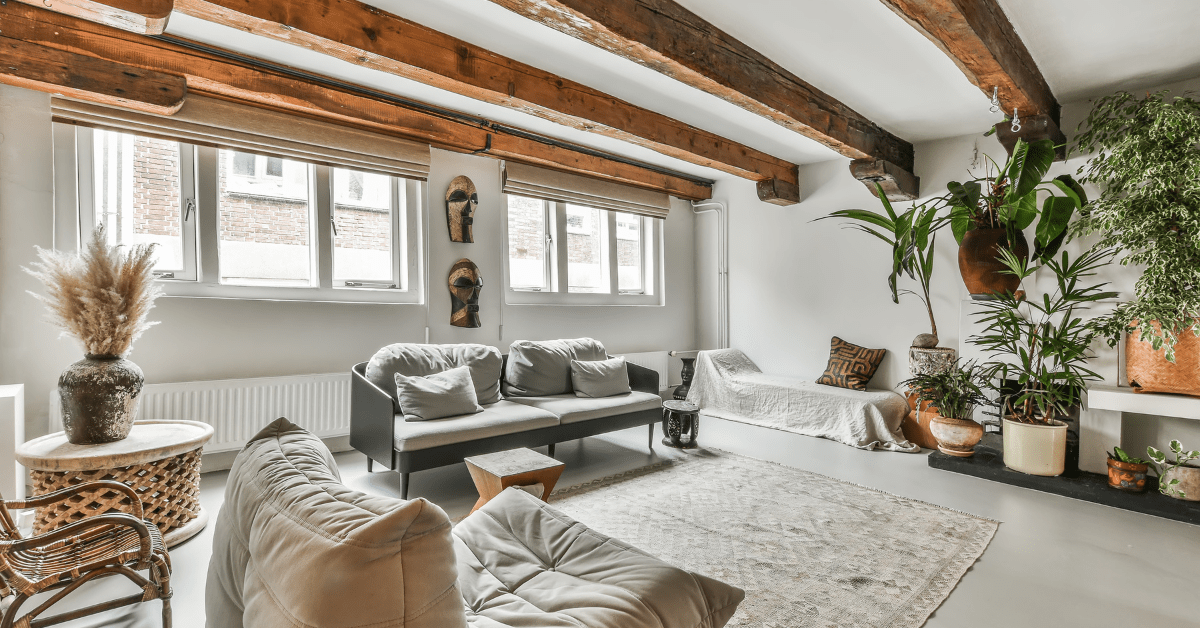 Family room with wooden ceiling beams.