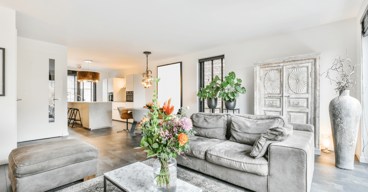 A homey living room dining room combo with plants.