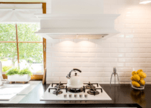 Modern kitchen with black countertops.