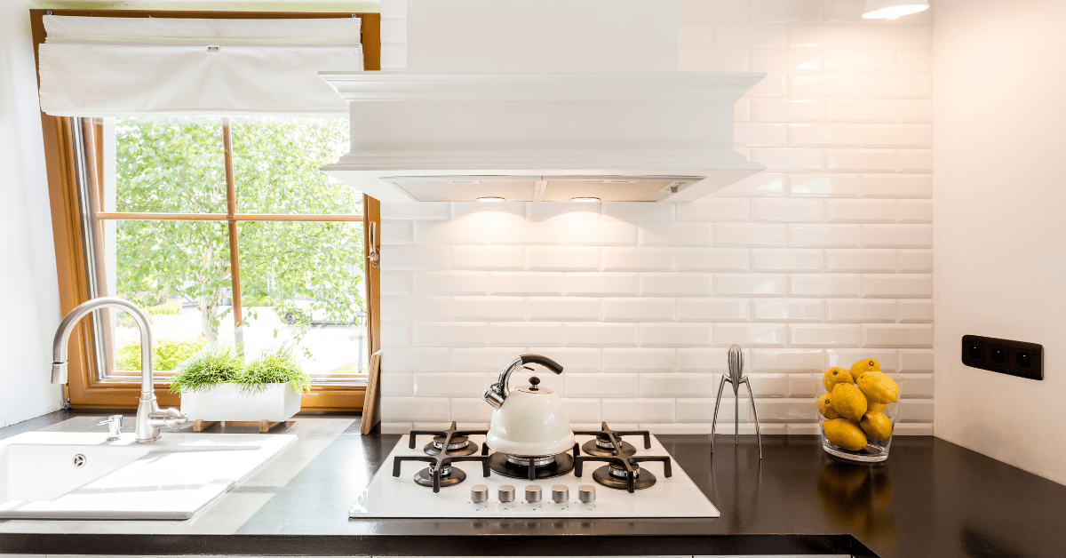 Modern kitchen with black countertops.