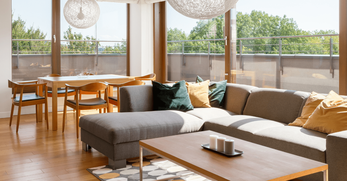 A living room dining room combo layout with rug.