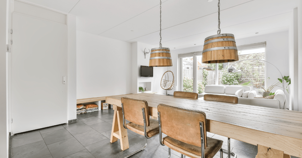 A well decorated living room dining room combo with a cohesive theme.