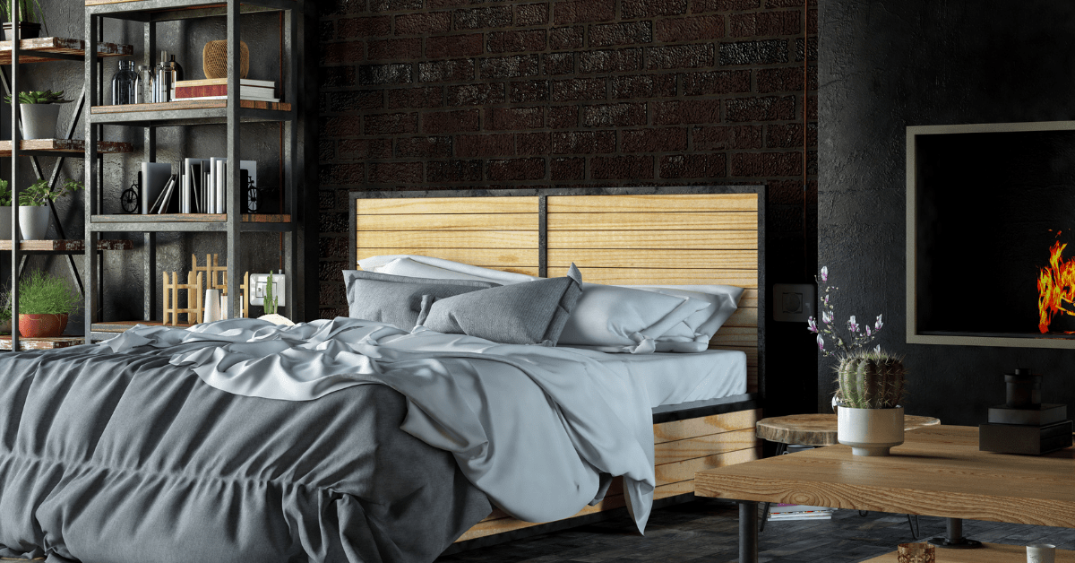 A black bedroom with wooden furniture.