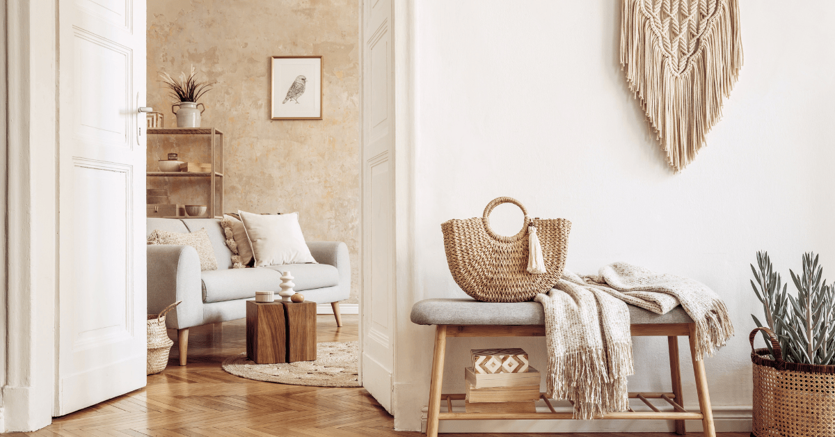 Boho living room with natural colors and grey furniture with wooden frames.