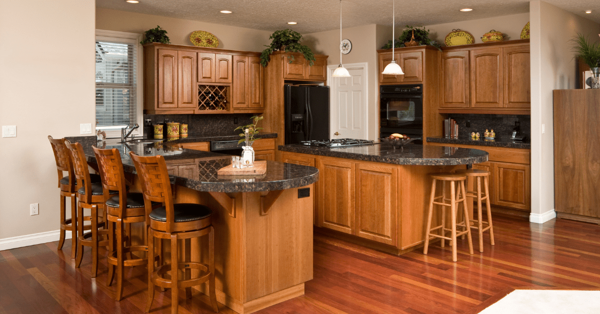 Double kitchen islands made of wood with stool seating.