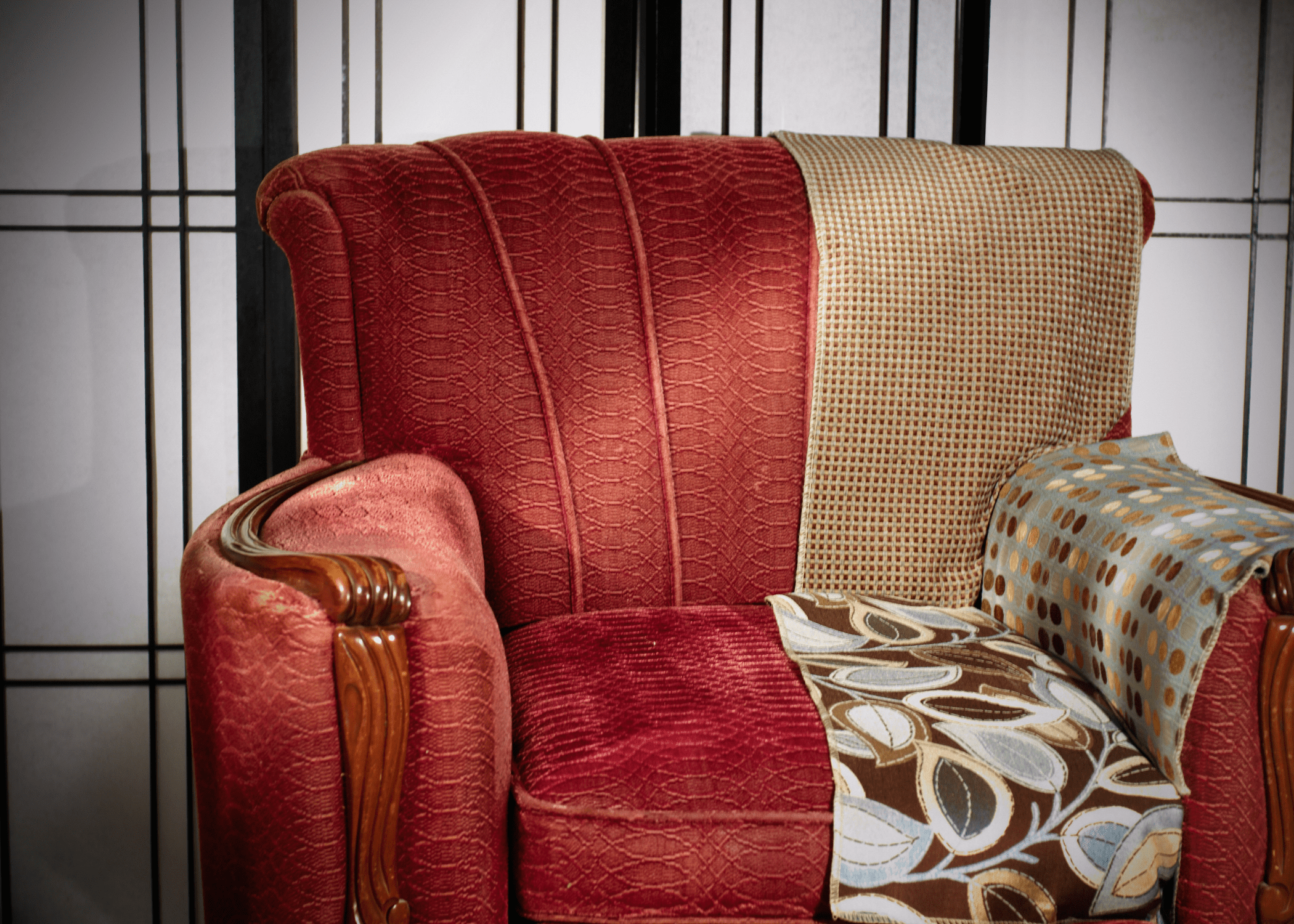 dated chair with swatches of fabric laid over it