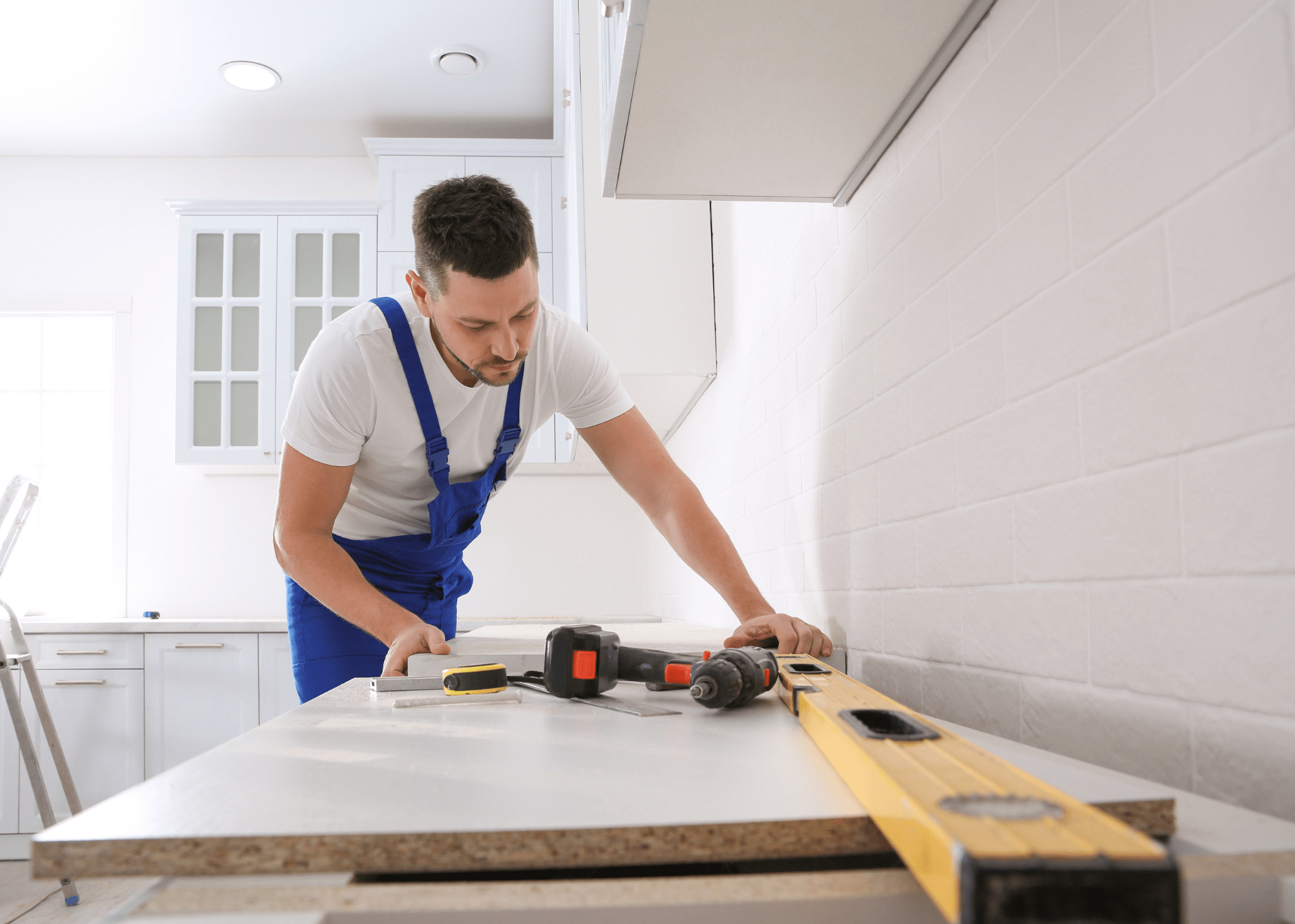 man installing laminate countertop