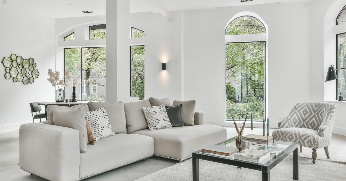 Modern living room with grey and white colors.