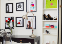 Chic girls bedroom with soft white wall color and floor to ceiling white cabinet with black trim. Bungalow 5 Jacqui Console Desk in Black faces a wall of framed photography with an adjustable desk lamp and trendy Ghost Chair.