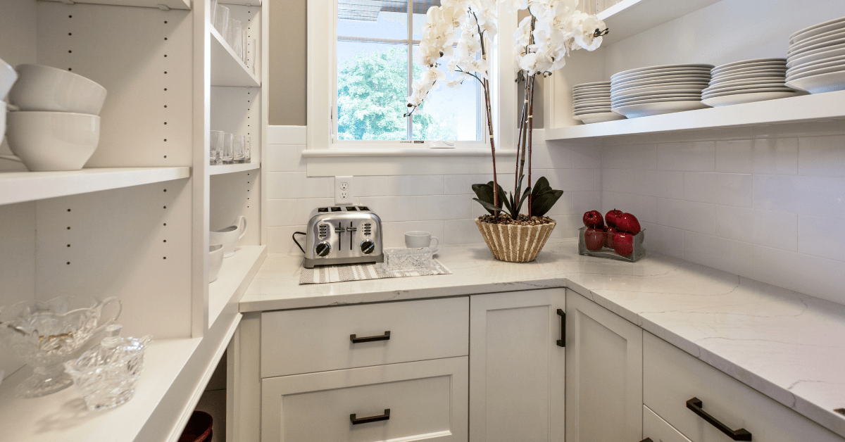 White walk in pantry with drawers and shelves.